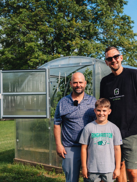 Gustavs with a customer and his son at their greenhouse in New York