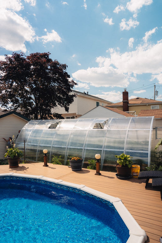 Polycarbonate greenhouse on a pool deck