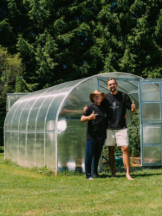 Gustavs and his father at the greenhouse door