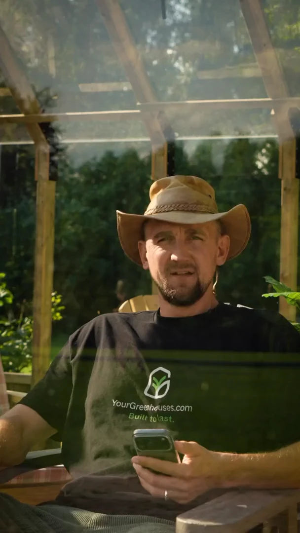 Gustavs sitting inside a Nordwood greenhouse during the glass test
