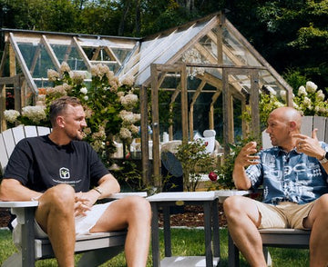 Gustavs with the New York dealer in front of a Nordwood greenhouse on his lot