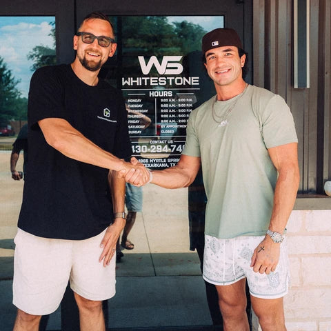 Gustavs shaking hands with the owner of Whitestone Steel outside their Texarkana, Texas showroom