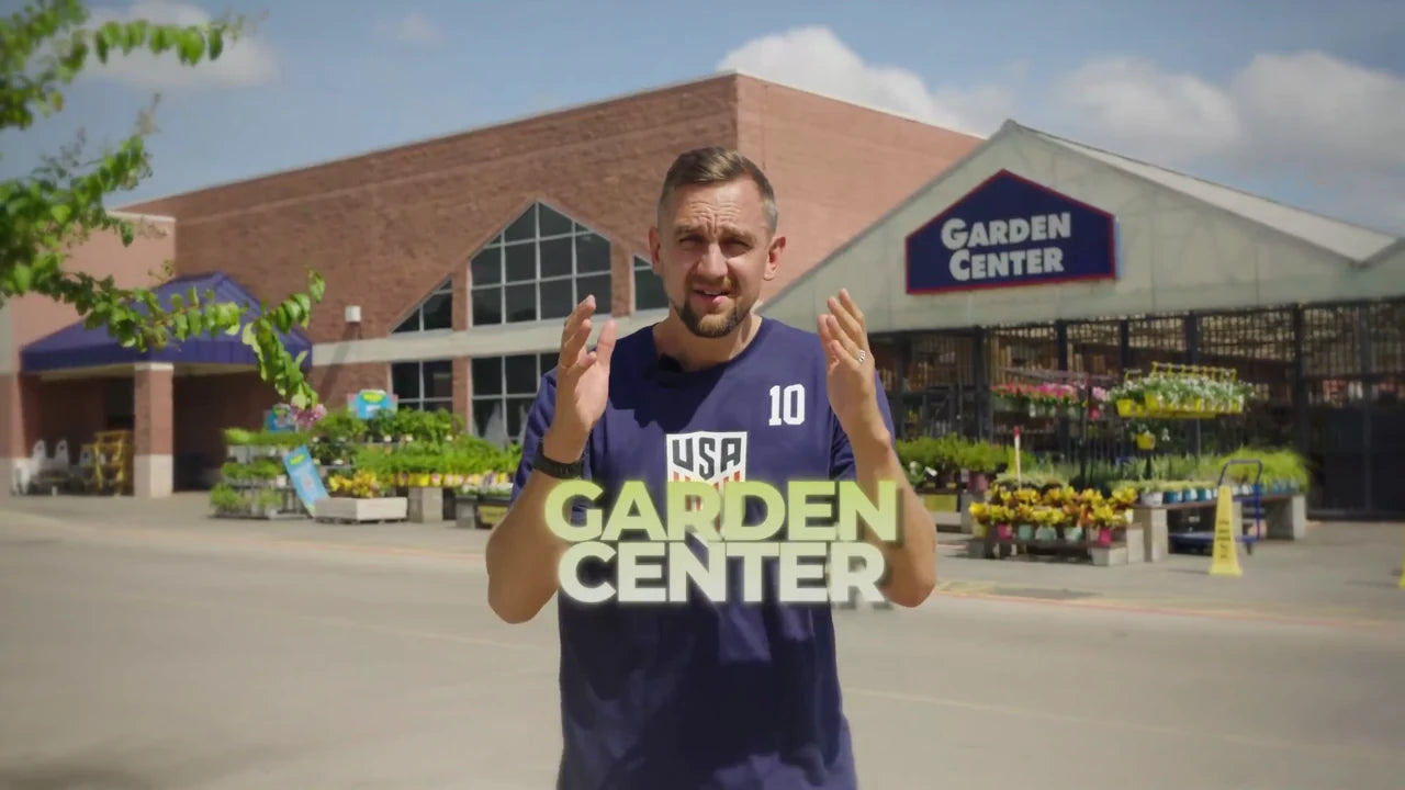 Gustavs, founder of YourGreenhouses, in front of a garden center